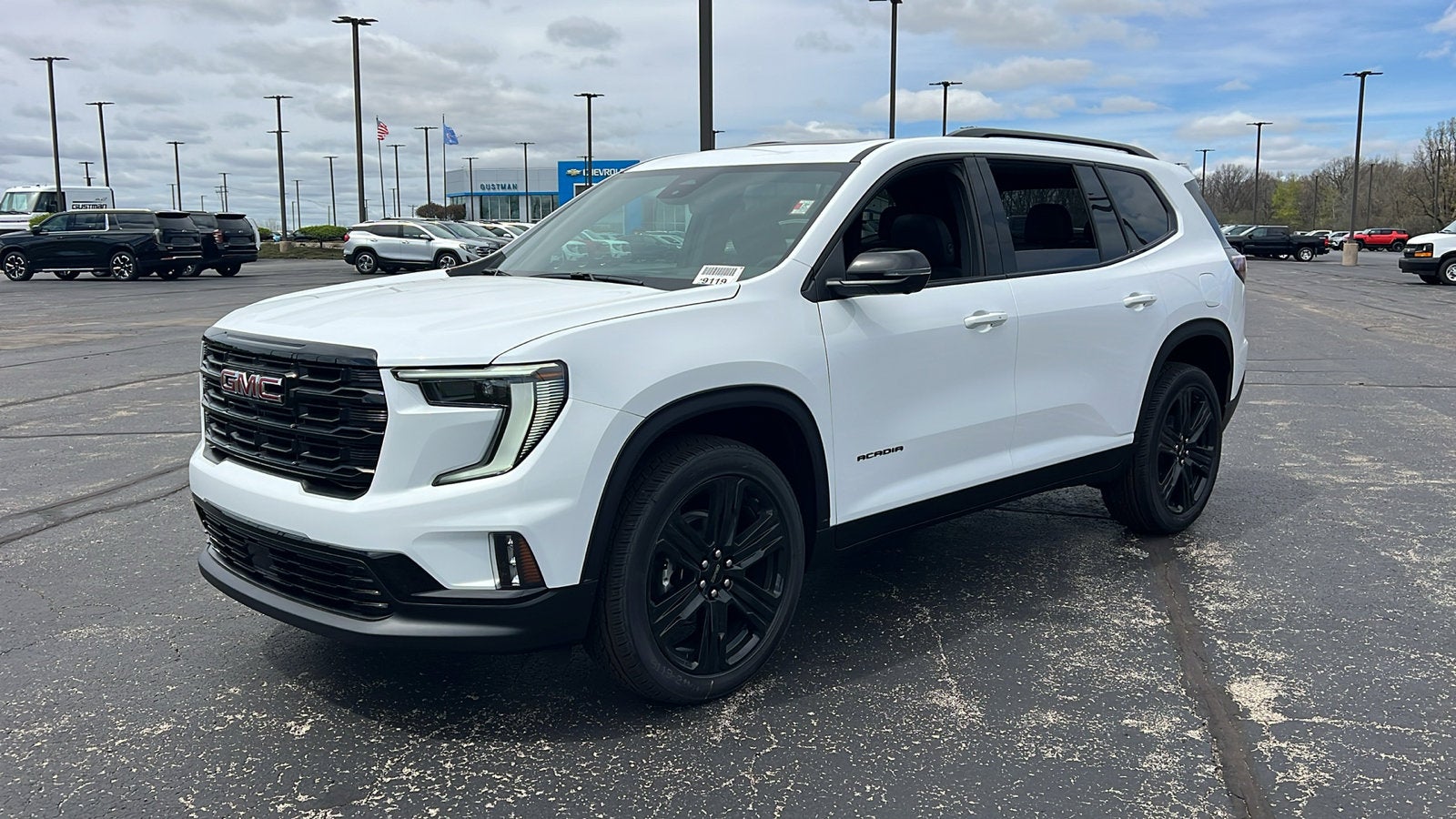 2026 GMC Acadia Elevation in Summit White — front three-quarter view