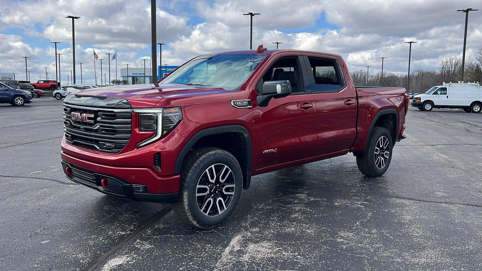 2026 GMC Sierra 1500 AT4 in Volcanic Red Tintcoat — front three-quarter view