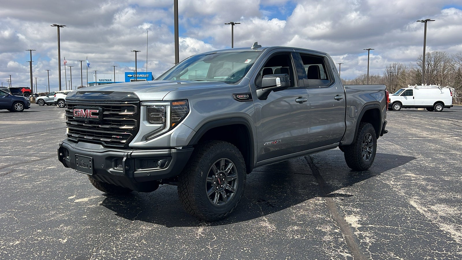 2026 GMC Sierra 1500 AT4X in Sterling Metallic — front three-quarter view