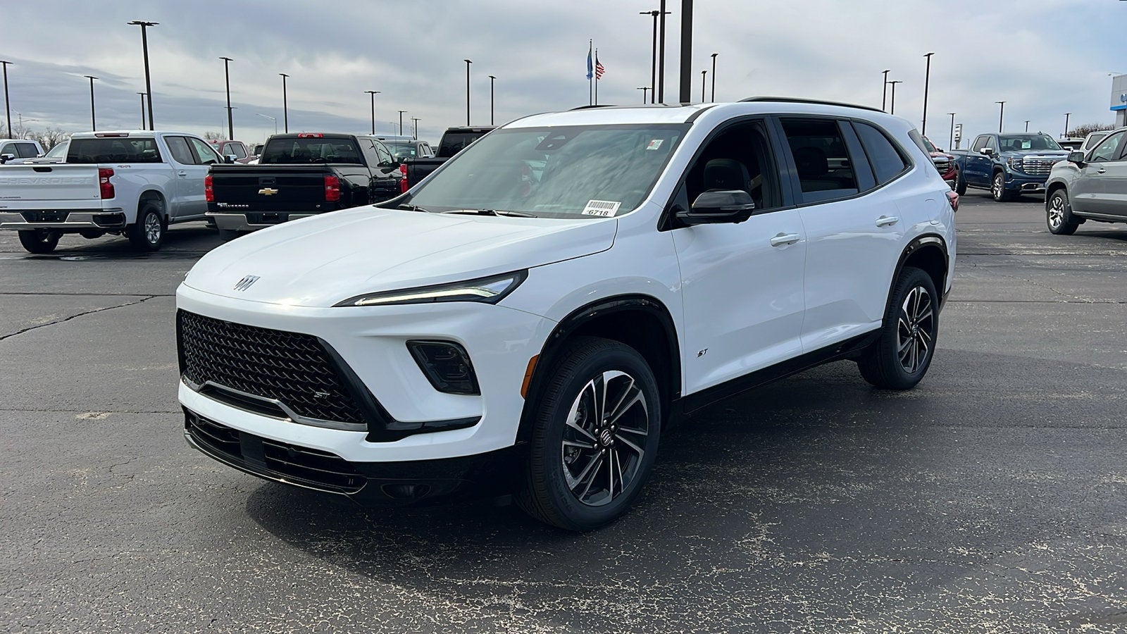 2026 Buick Enclave Sport Touring in Summit White — front three-quarter view