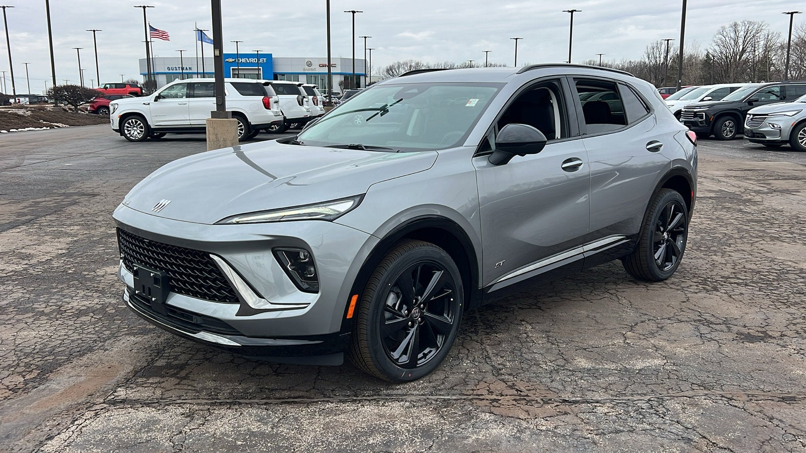 2026 Buick Envision Sport Touring in Moonstone Gray Metallic — front three-quarter view