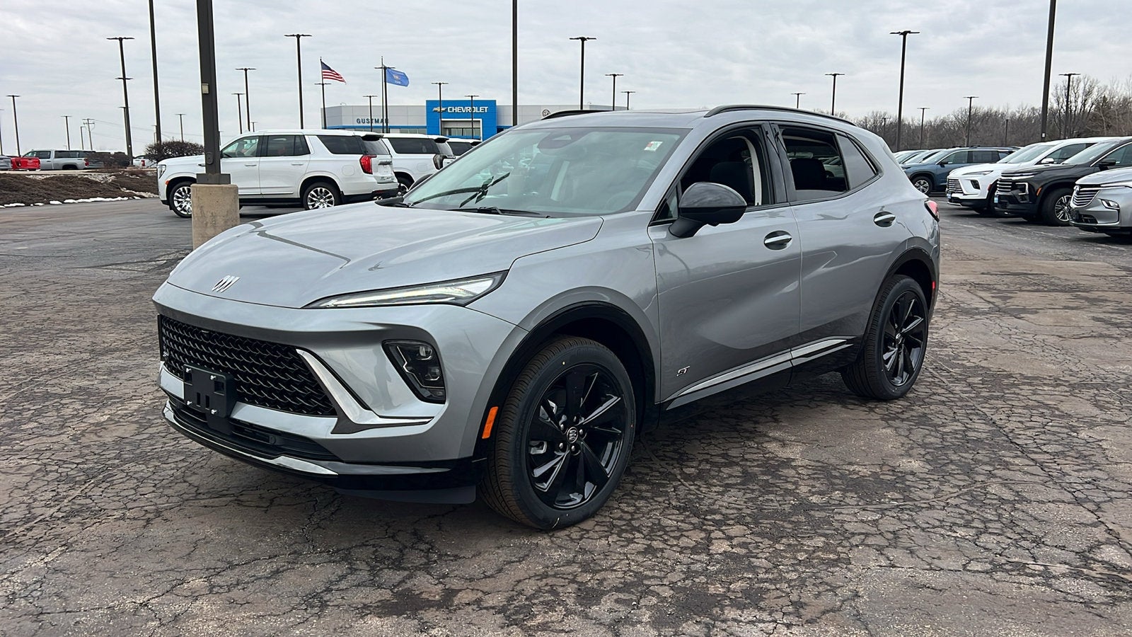 2026 Buick Envision Sport Touring in Moonstone Gray Metallic — front three-quarter view