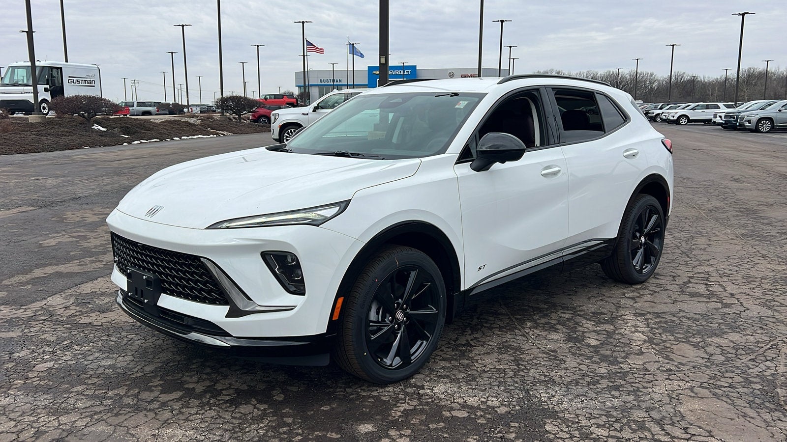 2026 Buick Envision Sport Touring in Summit White — front three-quarter view