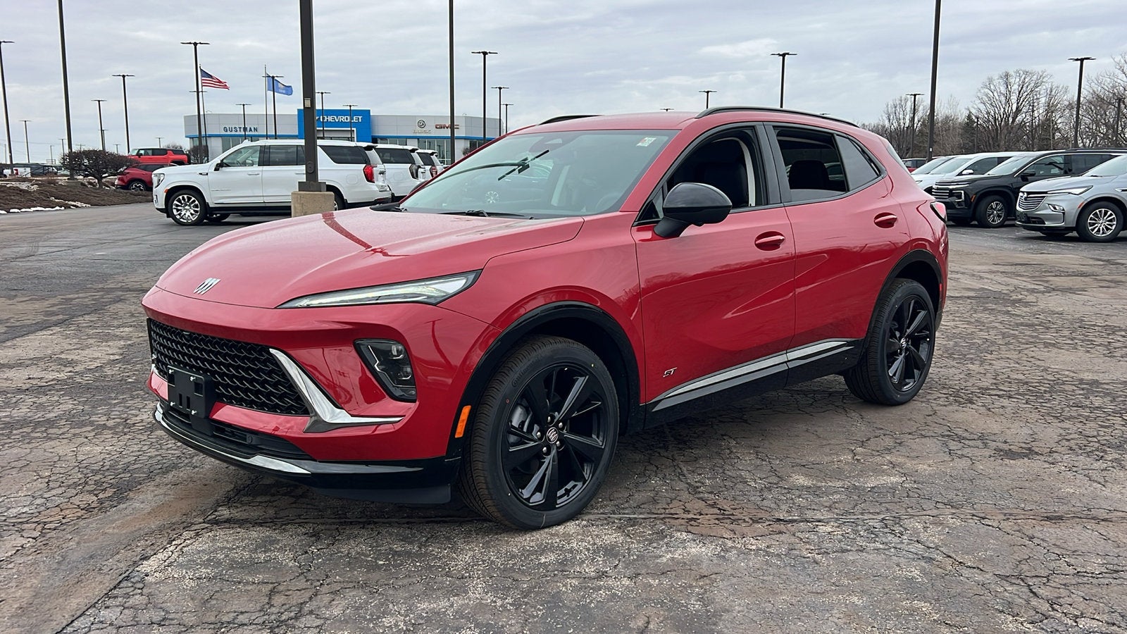 2026 Buick Envision Sport Touring in Brilliant Red — front three-quarter view