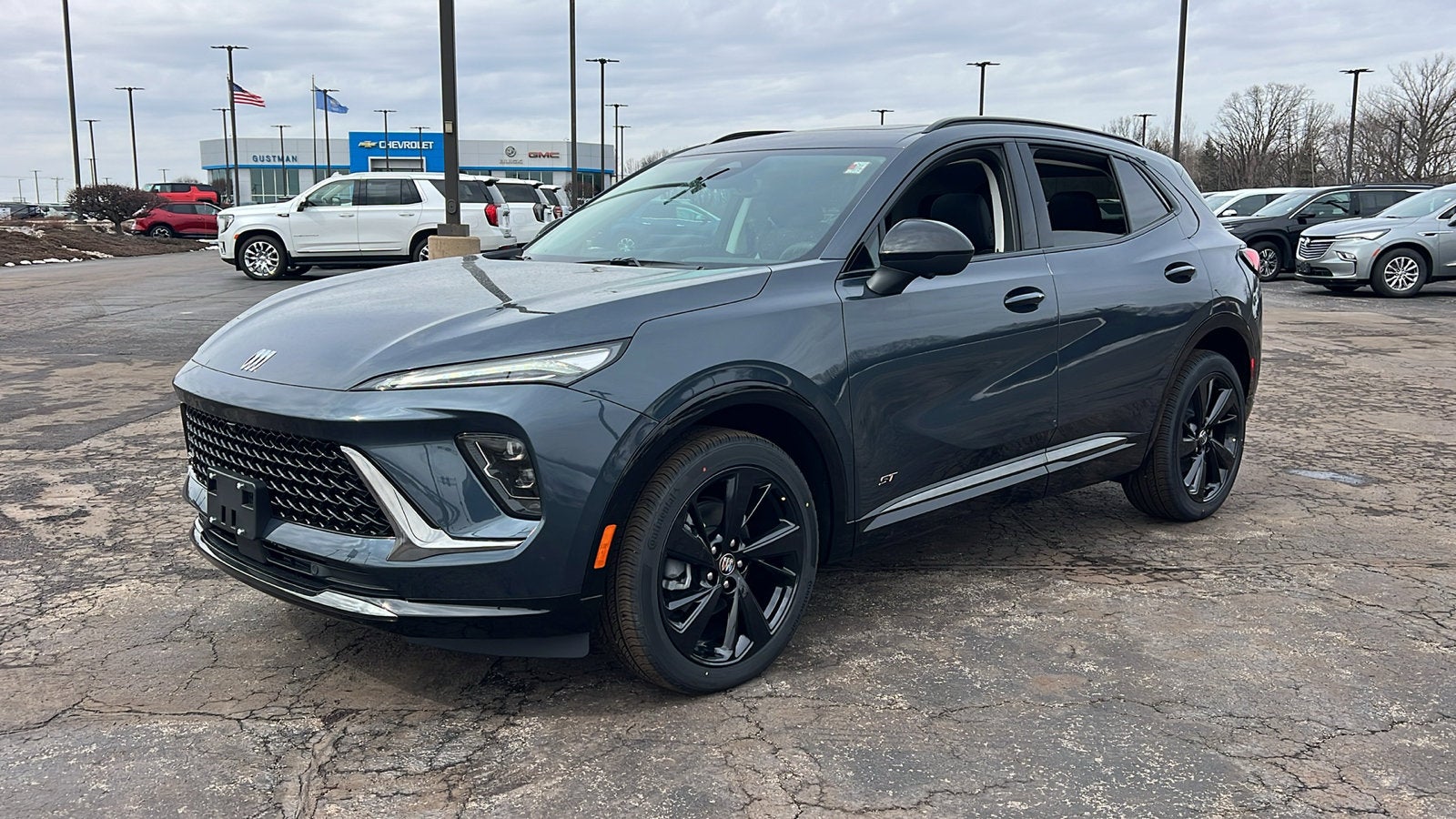 2026 Buick Envision Sport Touring in Quartz Blue Metallic — front three-quarter view