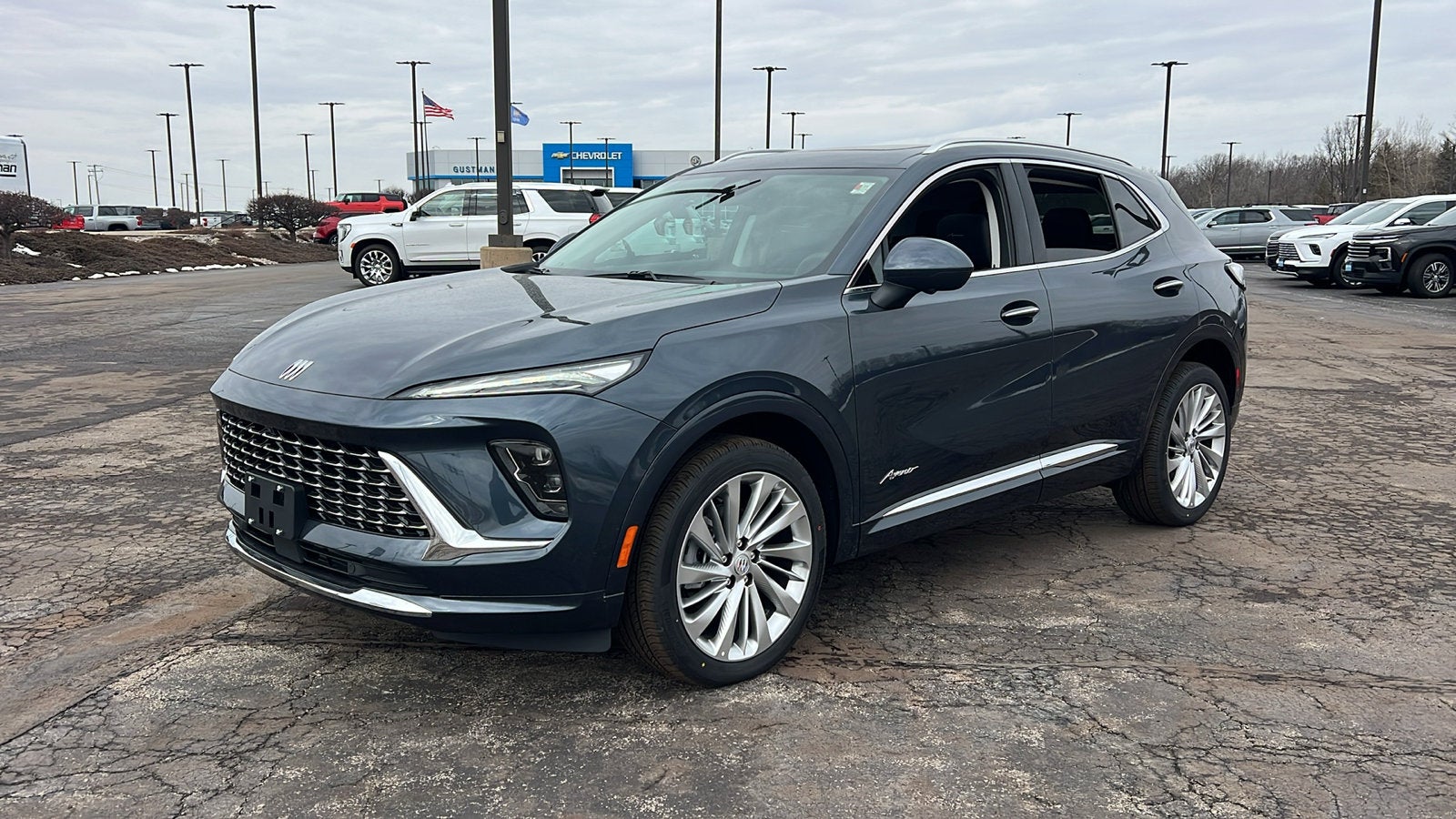 2026 Buick Envision Avenir in Quartz Blue Metallic — front three-quarter view
